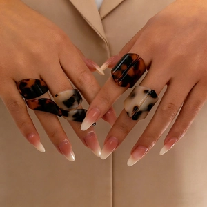 Irregular acrylic leopard print rings set in brown and beige colors for women