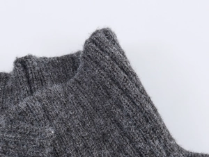 Close-up of high-quality dark gray ribbed knit fabric texture on a stand-up collar set
