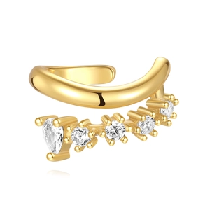 Detail of gold ear cuff featuring five round sparkling cubic zirconia on a polished metal band