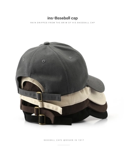 Detail of adjustable metal buckles on cotton baseball caps in four classic colors