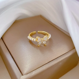 Gold butterfly ring with white enamel and zircons, adjustable open band with pearls