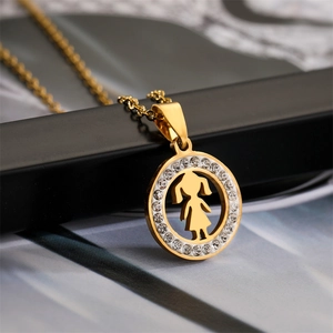 Detailed close-up of a golden cutout girl pendant necklace with sparkling crystal halo