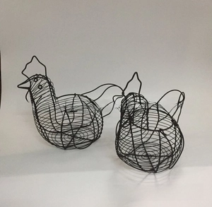 Detailed view of handmade black wire chicken shaped storage baskets in two sizes