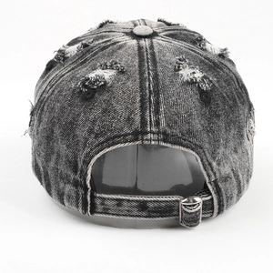 Vintage distressed washed denim baseball cap with ripped details and metal back strap buckle