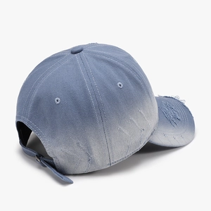 Distressed blue gradient baseball cap in washed denim with adjustable metal buckle back