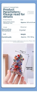 Macro shot of 8.5x6.5cm resin crystal Christmas tree desktop ornament held in hand