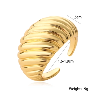 Detail of 1.5cm wide gold plated croissant ring with ribbed texture and adjustable opening
