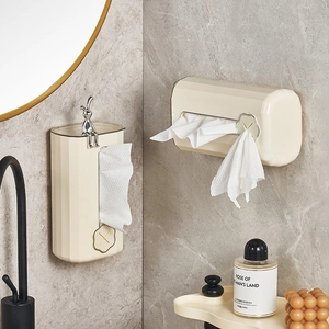 Cream wall-mounted tissue box with pleated texture and silver bunny accent for bathroom