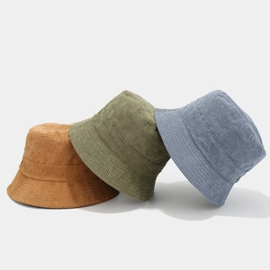 Three corduroy bucket hats in khaki, olive green, and fog blue shown on white background