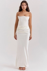 Detailed close-up of white satin corset bodice with boning structure and waist pleats