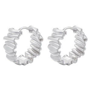 Detailed view of silver hoop earrings featuring unique irregular wavy pleated texture