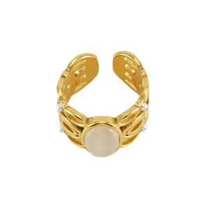 Macro detail of 18k gold plated vintage ring with malachite stone and pearl accents