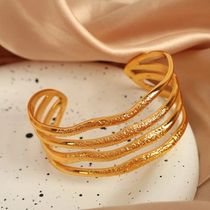 Chic 18K gold plated stainless steel cuff with unique textured wave design and open band
