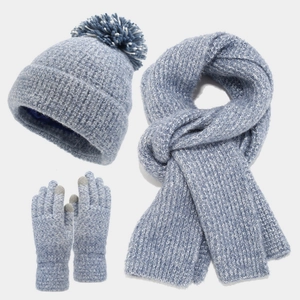 Three-piece light blue marl knit winter set with pom-pom beanie, scarf, and touch gloves