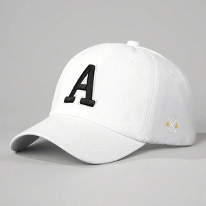 Close-up of white cotton baseball cap showing detailed black letter A embroidery and twill fabric