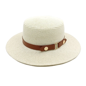 Minimalist wide brim beige straw sun hat with brown leather band and gold buckle