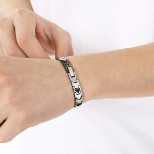 Close-up of a men's geometric tungsten steel bracelet featuring silver and black links