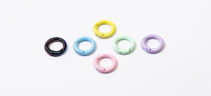 Macro detail of various colorful UV plated metal spring rings for DIY keychain making