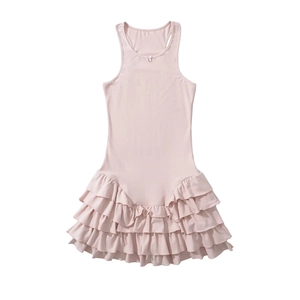 Close-up of pink sleeveless dress featuring a multi-layered ruffled skirt on white background