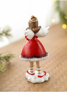 Detail view of resin Christmas girl figurine back showing golden wings and red glitter dress