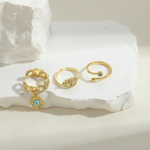 French vintage style gold rings with zircon flowers and evil eye accents on stones