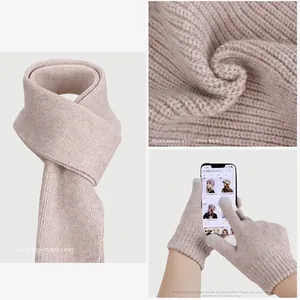 Three-piece winter knit set with oatmeal infinity scarf and touchscreen gloves