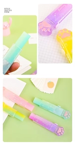 Detail of cute cat paw push-pull eraser with soft rubber padding in macaron gradient colors