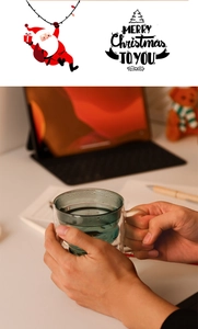 Detail of double-walled heat-resistant blue glass mug for Christmas window decorations