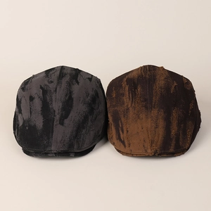 Close-up of vintage distressed ivy caps in grey and brown with wash textures