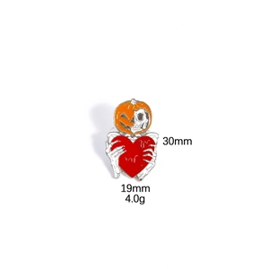 Halloween enamel pin featuring a pumpkin skull fusion holding a bright red heart