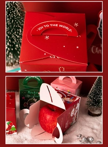 Detail of multi-color Christmas apple boxes with festive illustrations and top handle