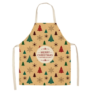 Detail of Christmas apron featuring Santa, reindeer patterns and Merry Christmas text