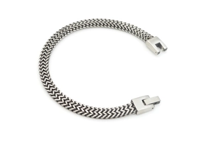 Detail of silver stainless steel double row woven chain bracelet with secure box clasp