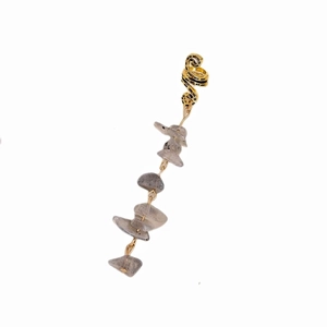 Detail of bohemian gold earring clip with long chain and natural grey stone pendants