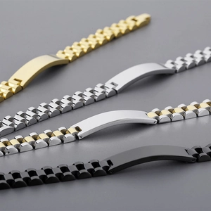 Detail view of four adjustable stainless steel ID bracelets in gold, silver, bicolor, and black