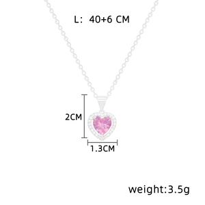 Detail shot of heart necklace pendant showing dimensions 2cm by 1.3cm and 40cm chain