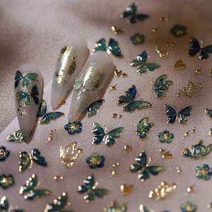 Stickers à ongles papillons de luxe avec bordures dorées et motifs dégradés bleu-vert