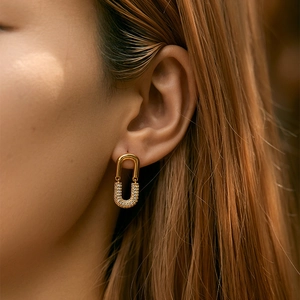 Elegant gold plated double layer hoop earrings with cubic zirconia pave on female model