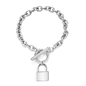 Detail view of silver stainless steel thick chain bracelet with OT toggle clasp and lock charm