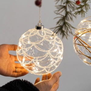 Luminous Christmas glass ball with warm LED lights and glitter mesh texture for decor