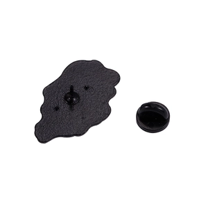 Detail view of the metal brooch back with sandblasted finish and black rubber pin clutch