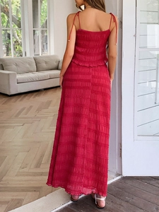 Rear view of red two-piece set featuring pleated texture camisole top and long skirt