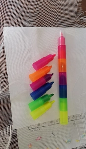 Detail view of 6-color stackable bear crayons showing disassembled pieces and full assembly