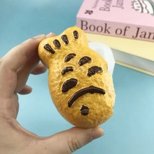 Close-up of realistic fish-shaped bread toy made of soft PU elastic material