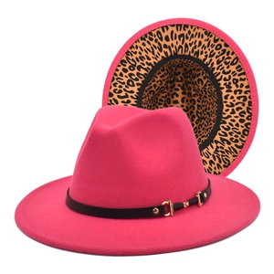 Hot pink fedora hat with leopard print brim lining and black leather band with gold buckle