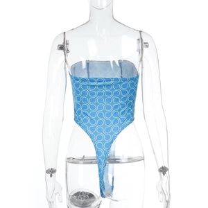 Detail of blue one-piece swimsuit with white spiral pattern on high-elastic fabric