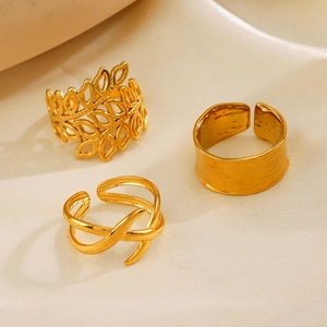 Three-piece gold adjustable ring set featuring leaf patterns and hammered texture finish