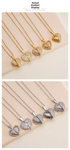 Macro detail of gold and silver heart pendants with cubic zirconia and filigree wings