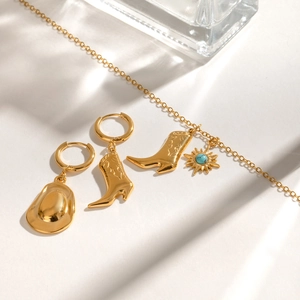 Golden stainless steel jewelry set with cowboy boot charms and turquoise sun pendant