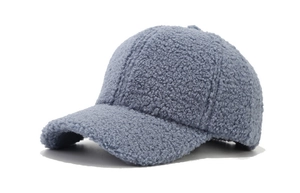 Detailed close-up showing the soft texture of light blue lamb wool on the baseball cap